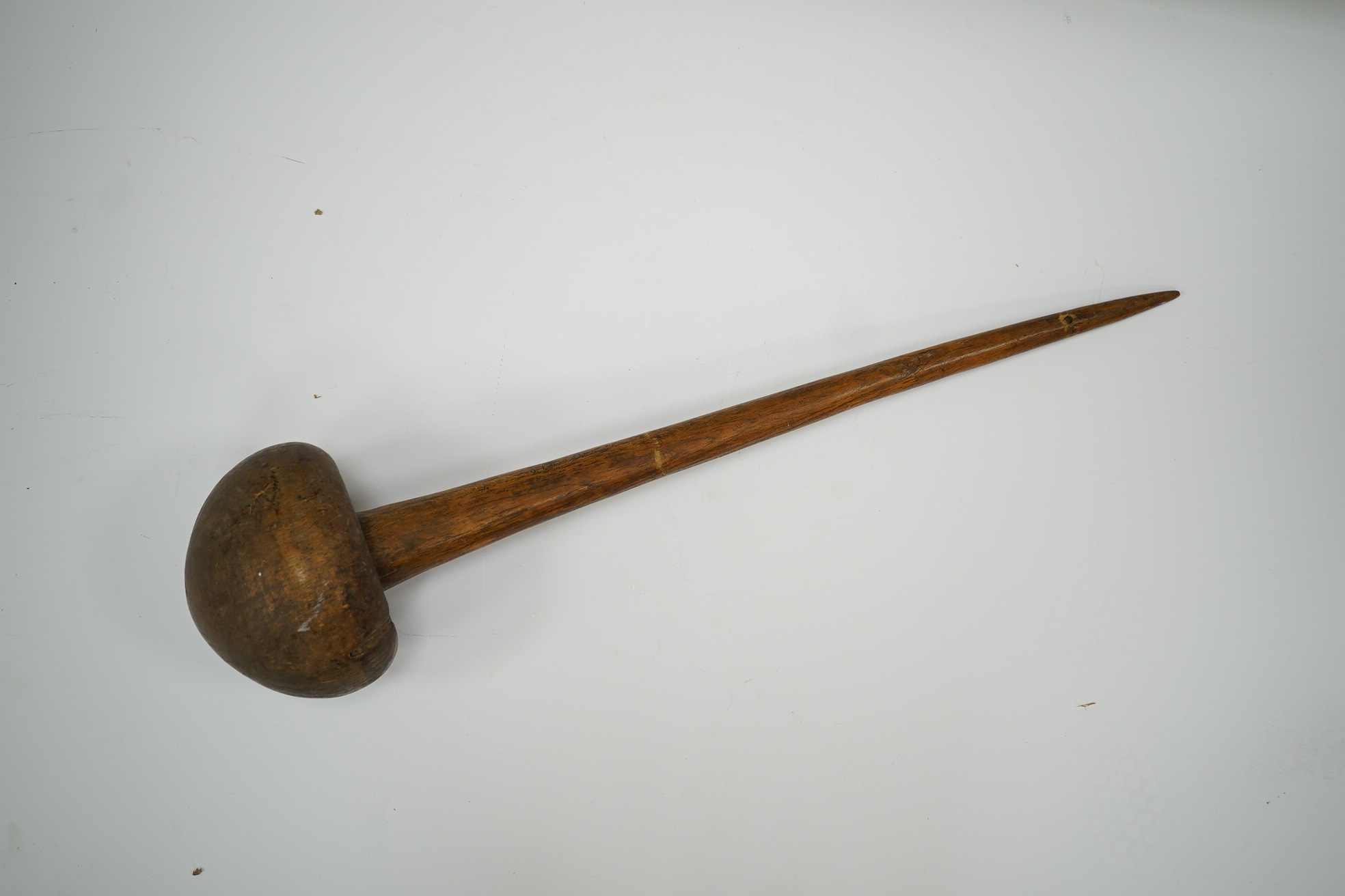 A Sudanese wooden Knobkerrie, approximately 62cm long, with profoundly swollen mushroom shaped head. Condition - poor to fair